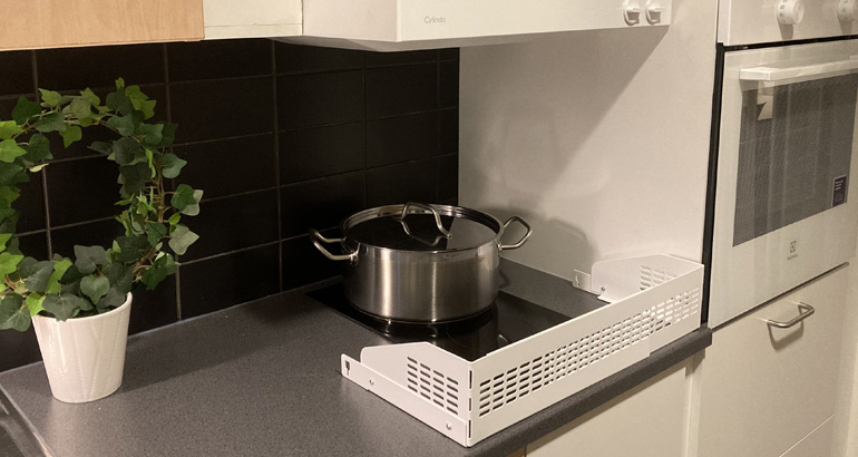 En spis med en gryta på.